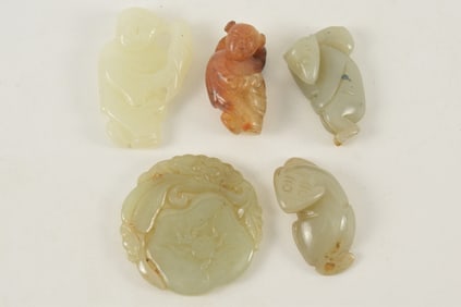 5 jade pendants. China. 19th/20th century. Largest 2in.