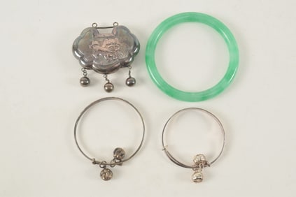 Lot of 3 items. A jadeite bracelet and 2 silver children's bracelets.
