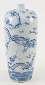 Porcelain vase. China. 19th century. Underglaze blue and red decoration of dragons and clouds.