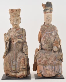 Lot of 2 wooden images. China. 19th century or earlier. Seated figures of deities with traces of