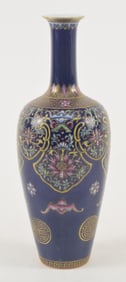 Porcelain vase. China. 20th century. Cobalt blue ground with enamel decoration of stylized floral