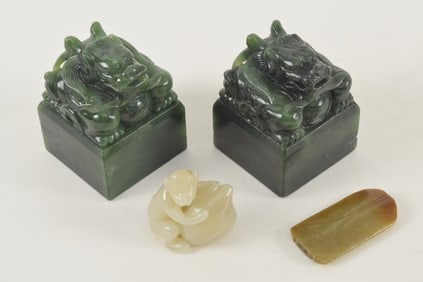 Lot of 4 jades. China. 20th century. To include: a pair of spinach green seals, a cicada, and a