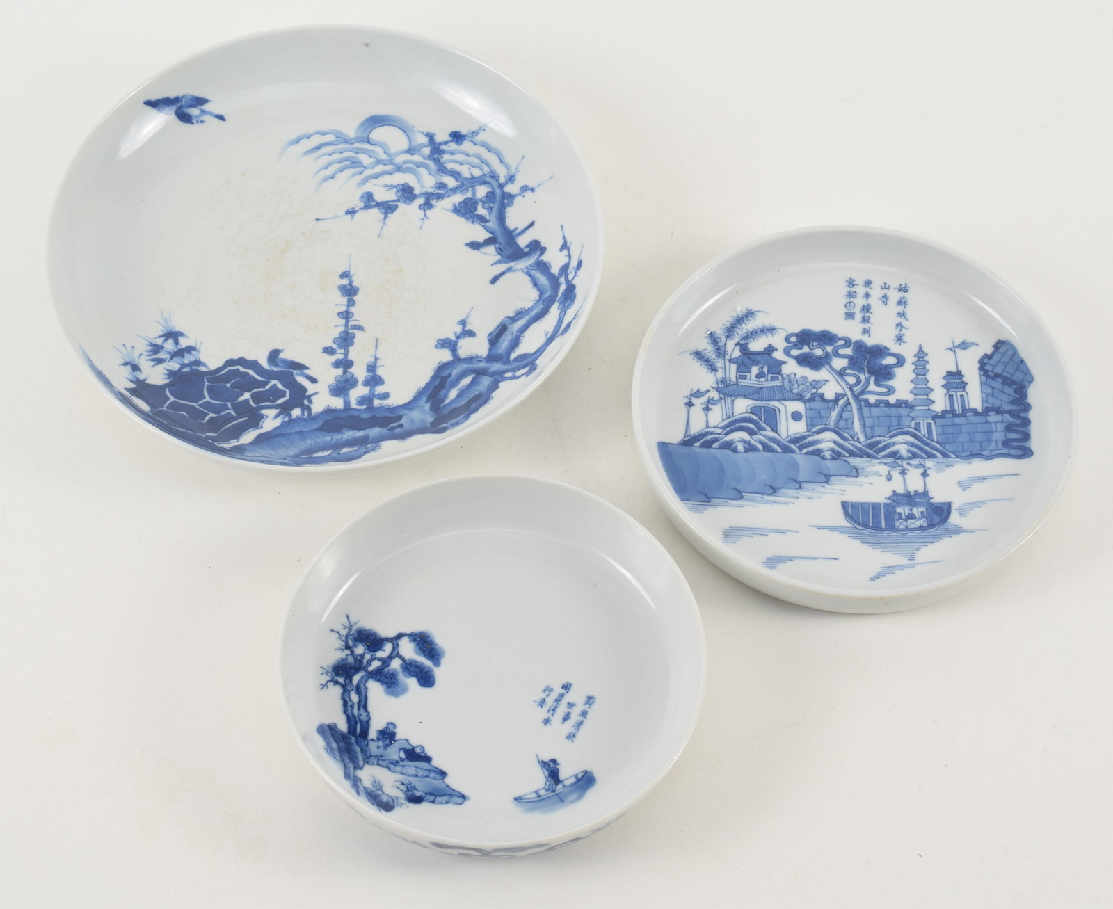 3 porcelain dishes. China. 19th century. Underglaze blue decoration. Largest 9in diameter. (1 of 7)