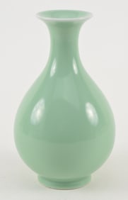 Porcelain wine bottle. China. 19th century. Sea green celadon glaze. Underglaze blue shop mark on