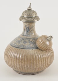 Anamese kendi. Vietnam. 16th century. Ribbed body with a floral underglaze blue band and neck. Base