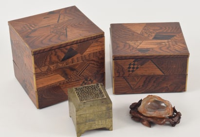 Lot of 4 items. To include: 2 marquetry boxes, Japan, 19th century; a paktong incense clock, and a