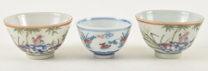 Lot of 3 porcelain wine cups. A Tou Tsai cup and a pair of famille rose cups. Early 20th century.