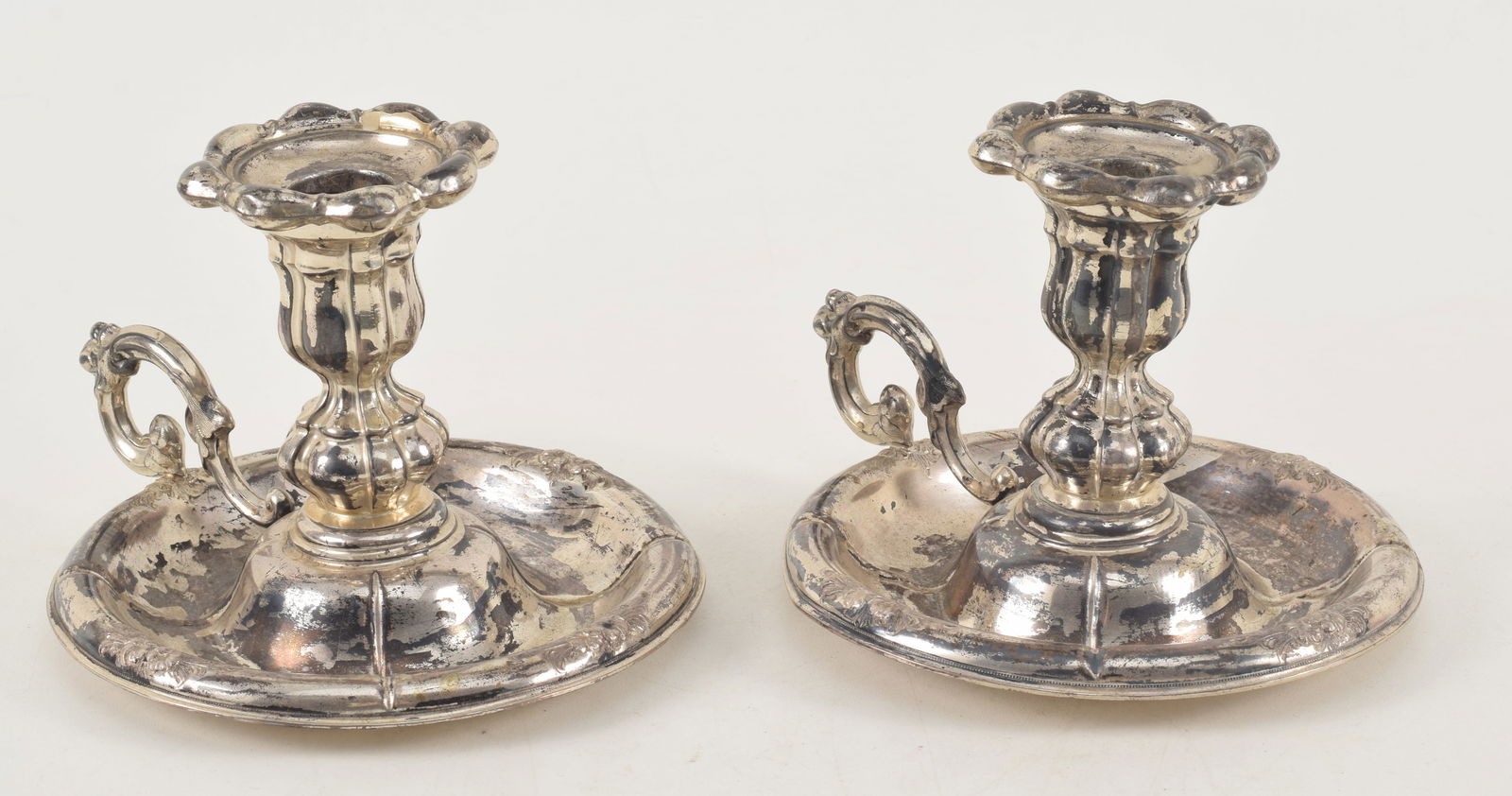 Pair of Russian silver candleholders. Embossed floral motifs. St. Petersburg city mark. 4.5in high. (1 of 14)