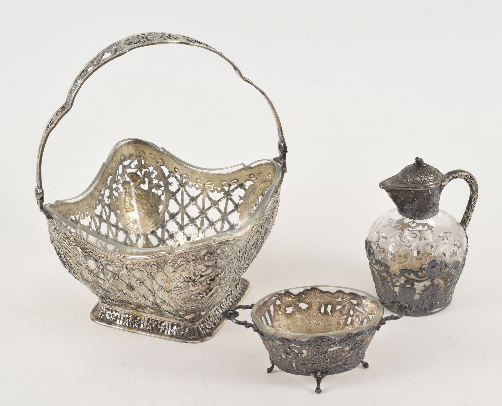 German 800 silver items. 1) Large handled basket reticulated floral design with cherubic motifs. (1 of 16)