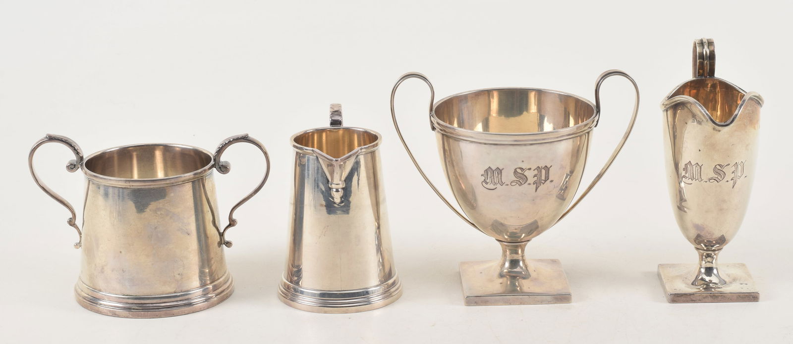 2 pairs of sterling silver cream pitchers and sugars. 1) Hand & Crane. Monogrammed. 2) Revere: 2 pairs of sterling silver cream pitchers and sugars. 1) Hand & Crane. Monogrammed. 2) Revere Silversmiths. Tallest 5in. 19 ozt total weight.