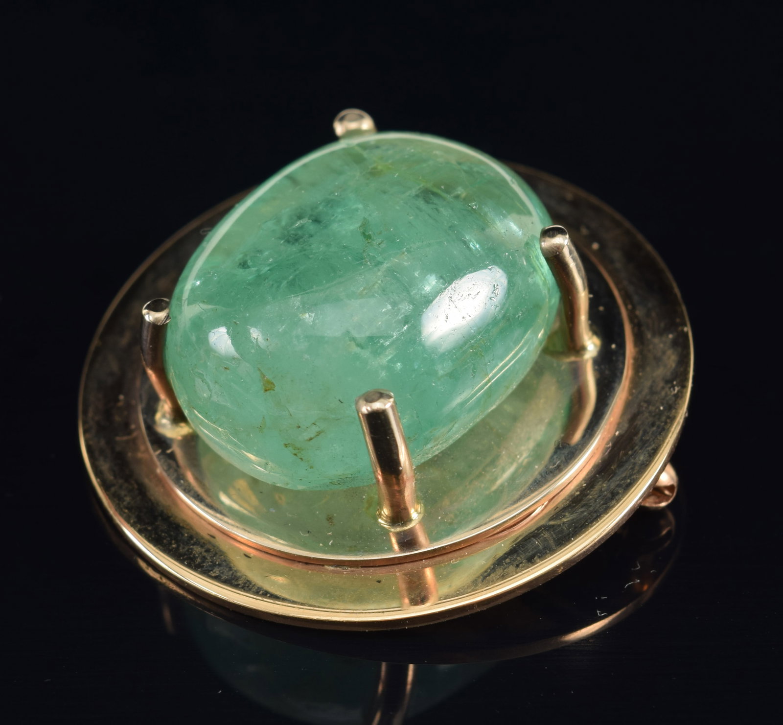 Tiffany 14K gold large 30-40cts emerald mounted pin. Tumbled emerald measuring approx. 17.4 x 21.1mm: Tiffany 14K gold large 30-40cts emerald mounted pin. Tumbled emerald measuring approx. 17.4 x 21.1mm (est. 30-40cts). Setting marked Tiffany 14K. 31.8mm diameter overall. 19.7 grams.