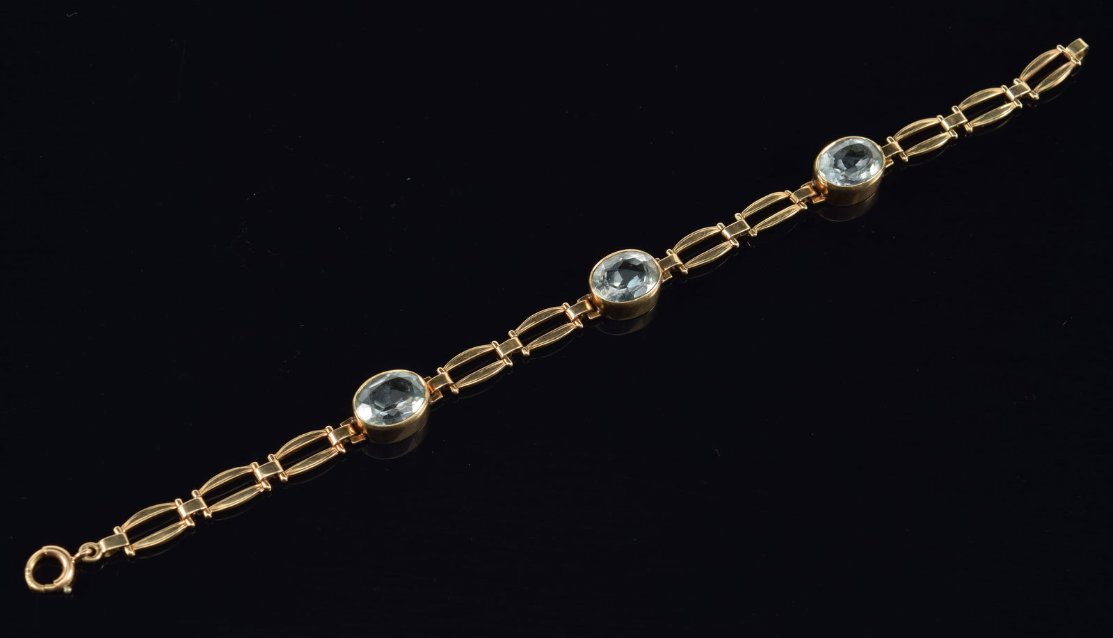 Vintage 14K gold aquamarine mounted bracelet. 3 oval cut stones (each about 9.8 x 7.8mm). Clasp: Vintage 14K gold aquamarine mounted bracelet. 3 oval cut stones (each about 9.8 x 7.8mm). Clasp marked 14K. 6.75in length. 8.8 grams.