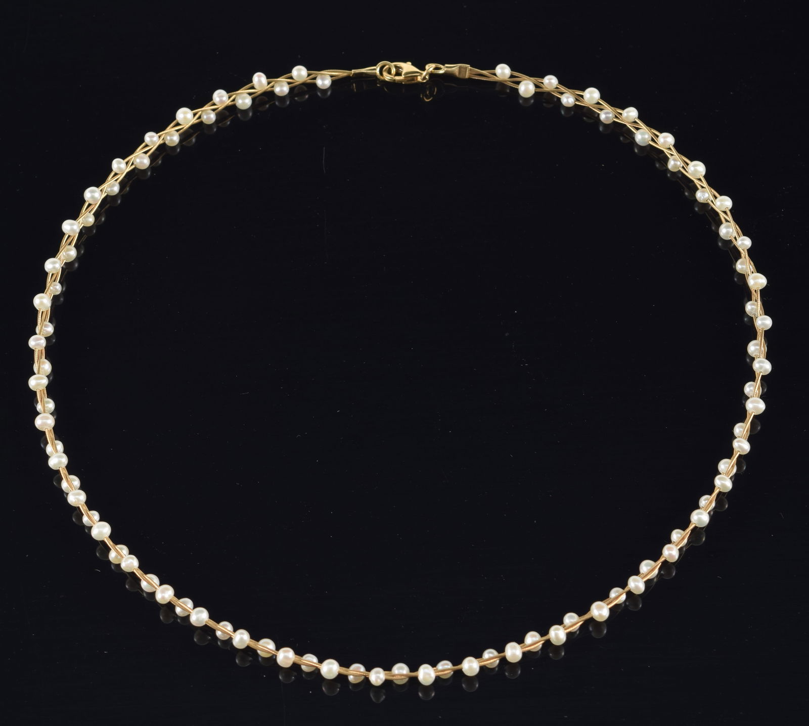 14K gold seed pearl choker necklace. Entwined seed pearls and woven gold strand design. Clasp marked (1 of 4)