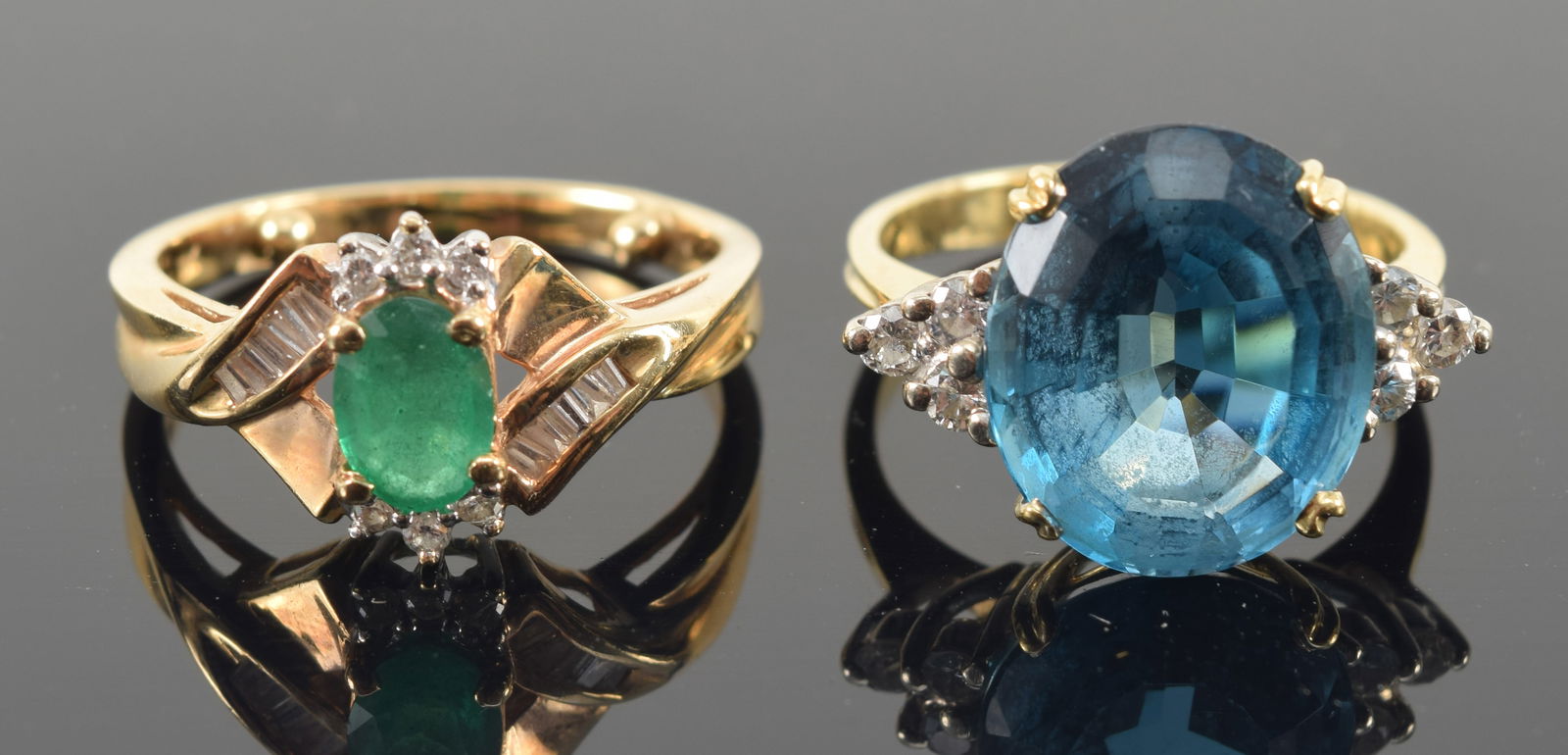 2 gold rings. 1) 14K emerald and diamond mounted ring. Marked 14K. Ring size: 6.75. 3.8 grams. 2) (1 of 5)