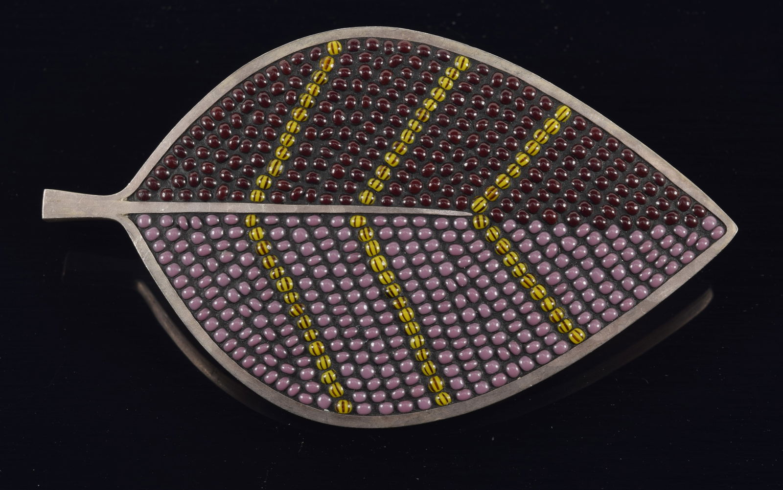 Mary Kanda sterling silver bead mosaic designer brooch. Amethyst and lavender tone purple beads: Mary Kanda sterling silver bead mosaic designer brooch. Amethyst and lavender tone purple beads separated by yellow and black beads. Signed on reverse. 3in length. 0.7 ozt.