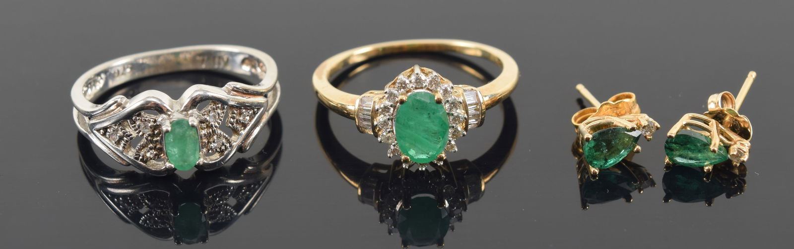 Lot of emerald jewelry. 1) 14K gold emerald with halo of tiny diamonds. Ring size 7. 2) Sterling (1 of 5)