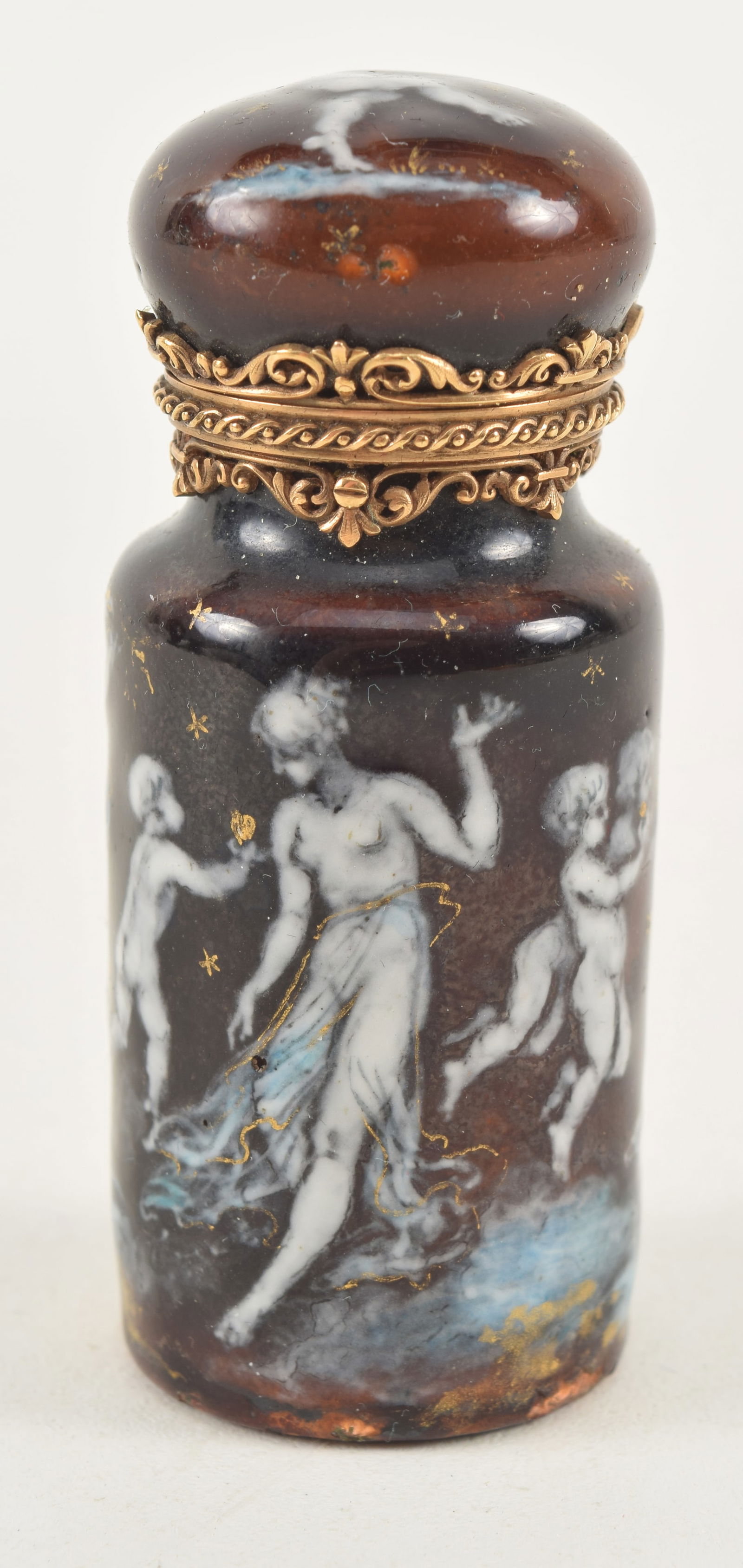 Antique enameled scent bottle. Cherubic figural scene on dark red ground with gilt highlights.: Antique enameled scent bottle. Cherubic figural scene on dark red ground with gilt highlights. Signed A. Meyer on base. Gilt metal mounts. 2.75in high. Slight enamel wear loss on foot.