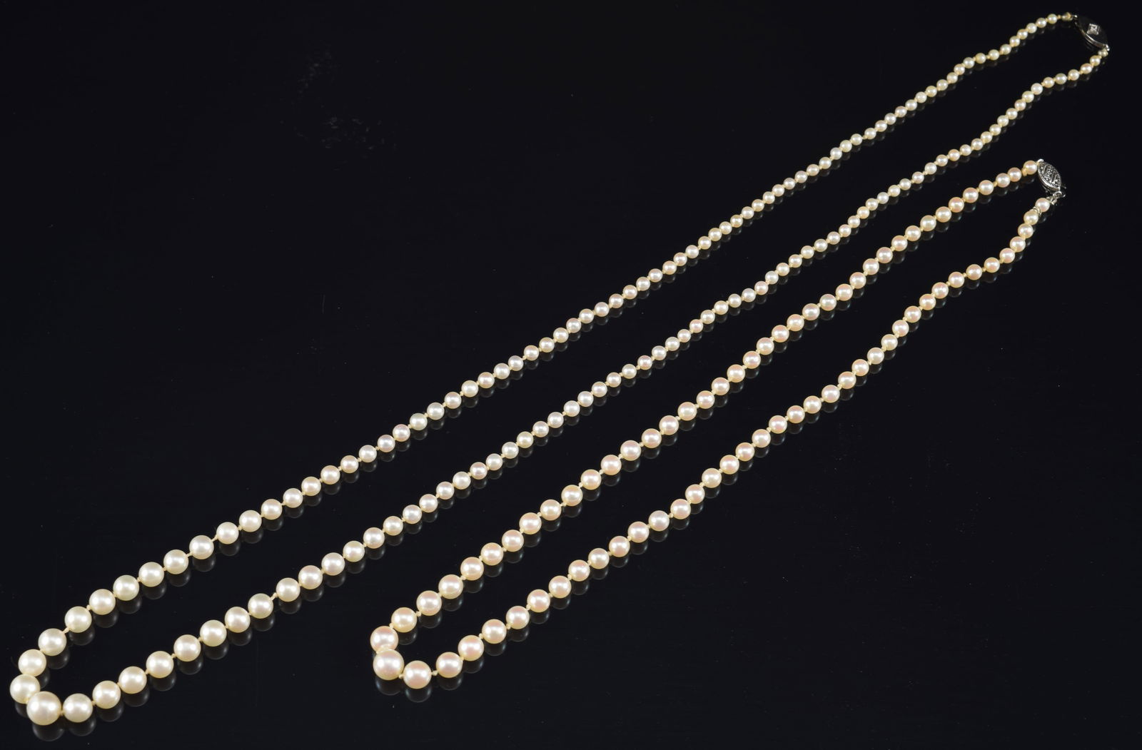 2 graduated pearl necklaces with gold clasps. 1) 10K clasp. 18in length. 2) 14K gold clasp with (1 of 4)