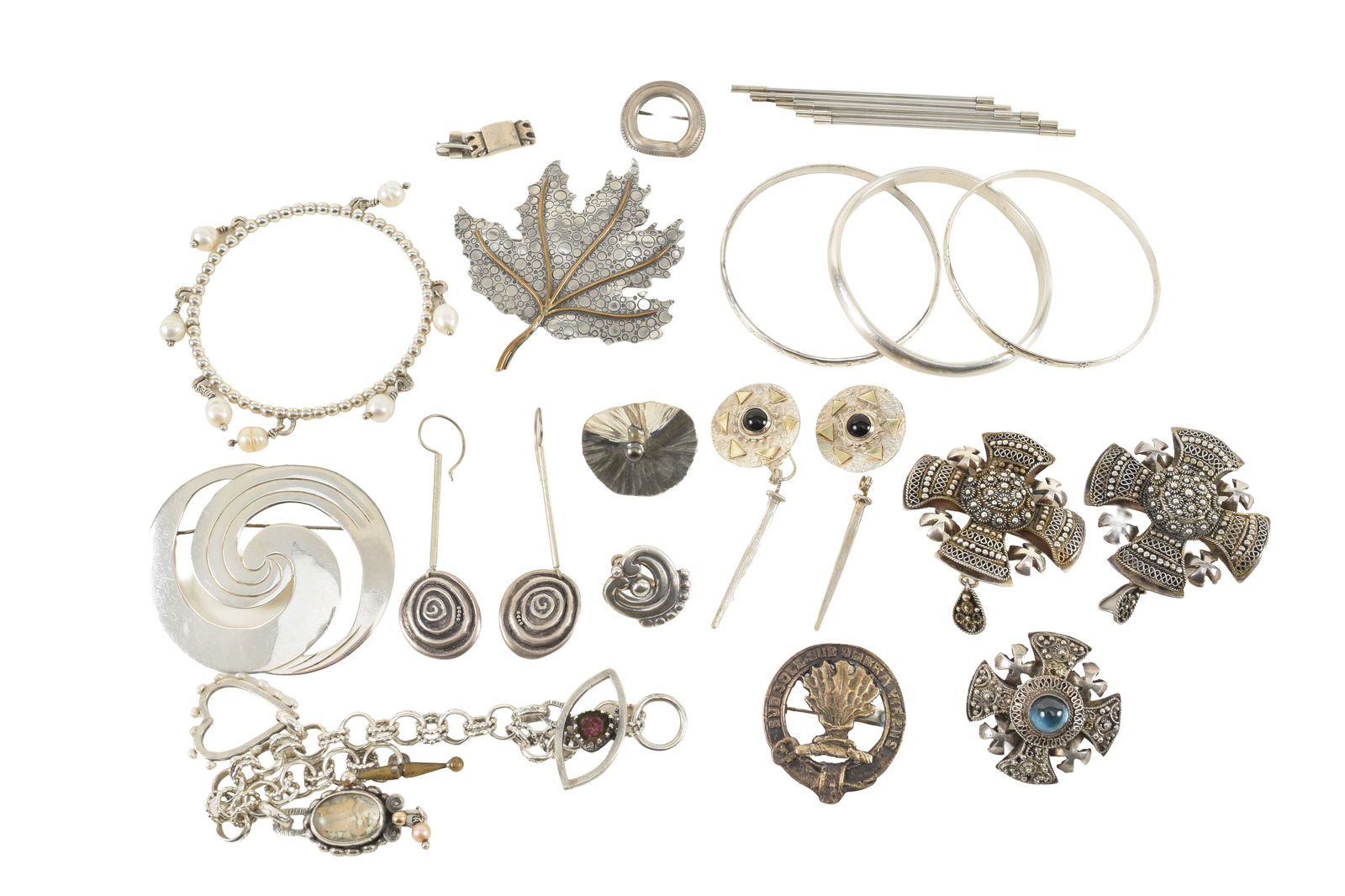 Lot of silver jewelry. To include: several Jerusalem cross pins, maple leaf brooch with gold (1 of 5)