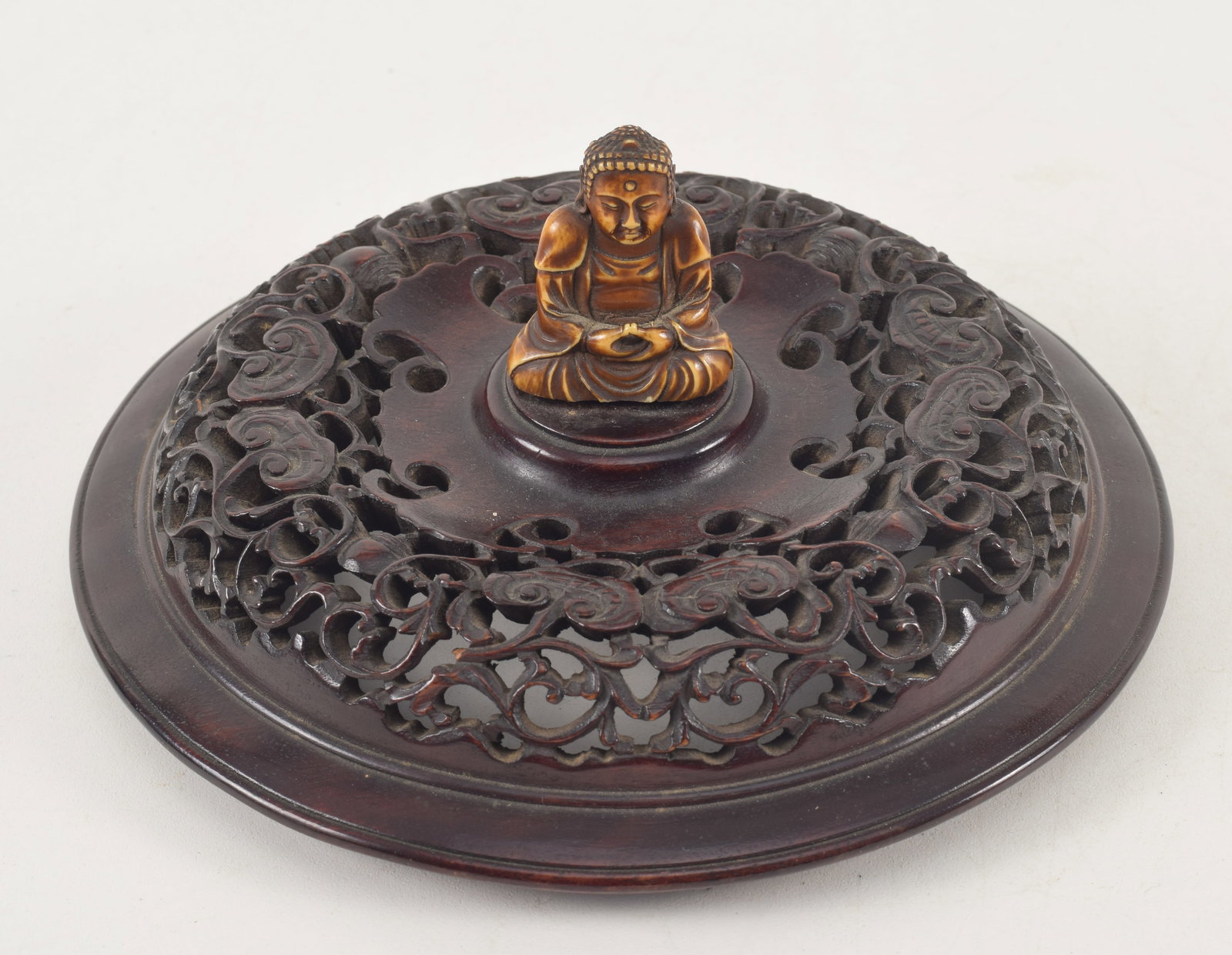 19th century Chinese carved wood cover with carved buddha finial. 6.25in diameter. Provenance: From: 19th century Chinese carved wood cover with carved buddha finial. 6.25in diameter. Provenance: From a Massachusetts collection.