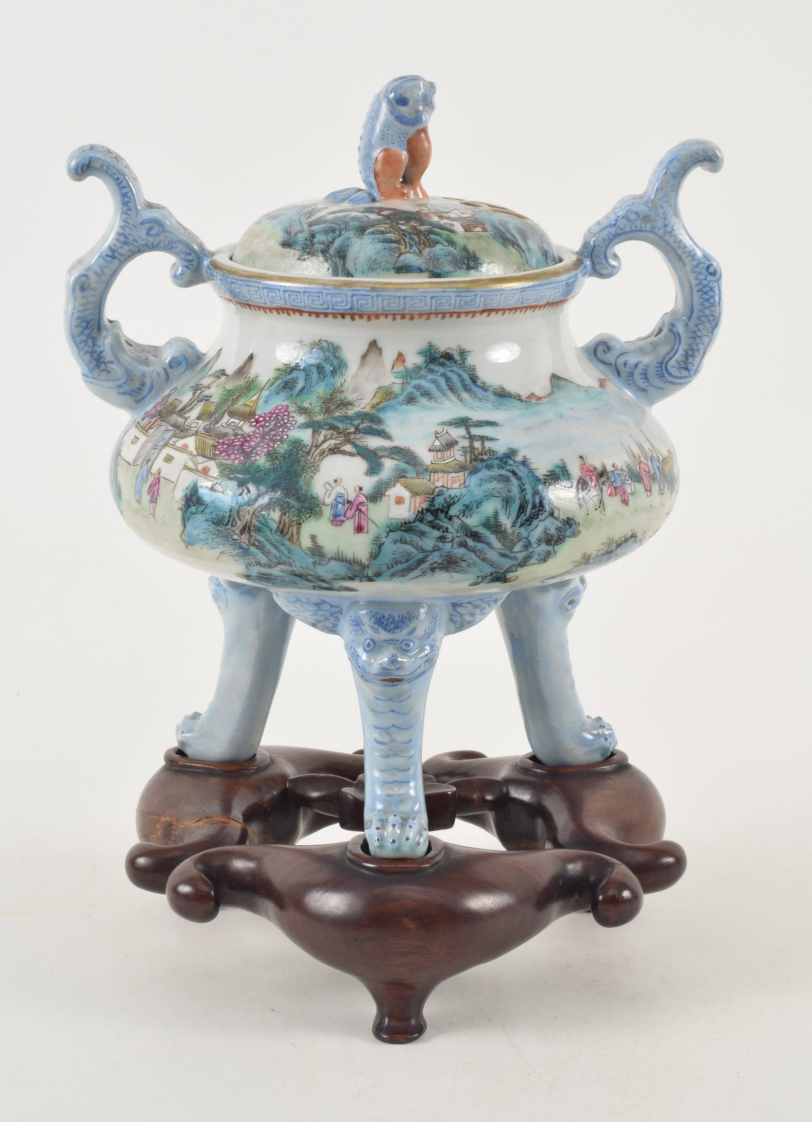 Chinese Republic period porcelain famille rose covered tripod censer on fitted stand. Landscape: Chinese Republic period porcelain famille rose covered tripod censer on fitted stand. Landscape decoration with figures. Elephant form legs and handles. Decorated dragon on the inside. Pierced cover w