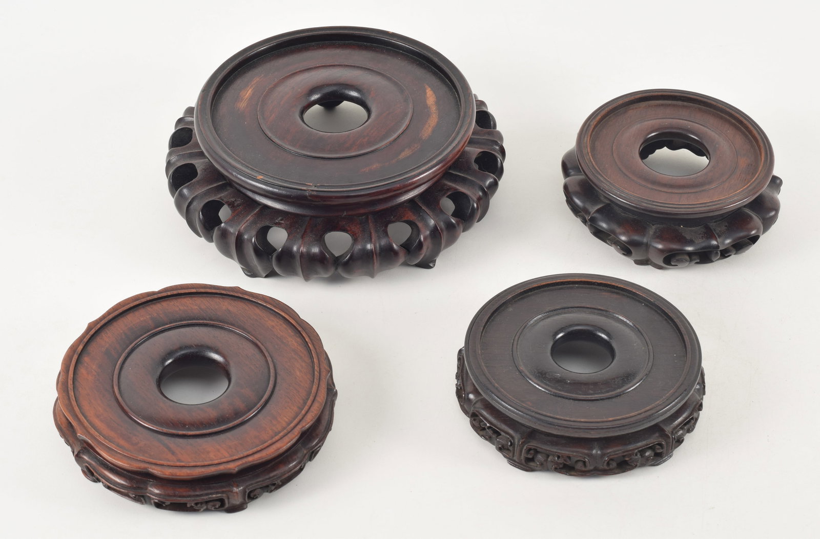 4 18th/19th century Chinese carved wood stands. Largest 8in diameter with 5.75in vase inset. (1 of 12)