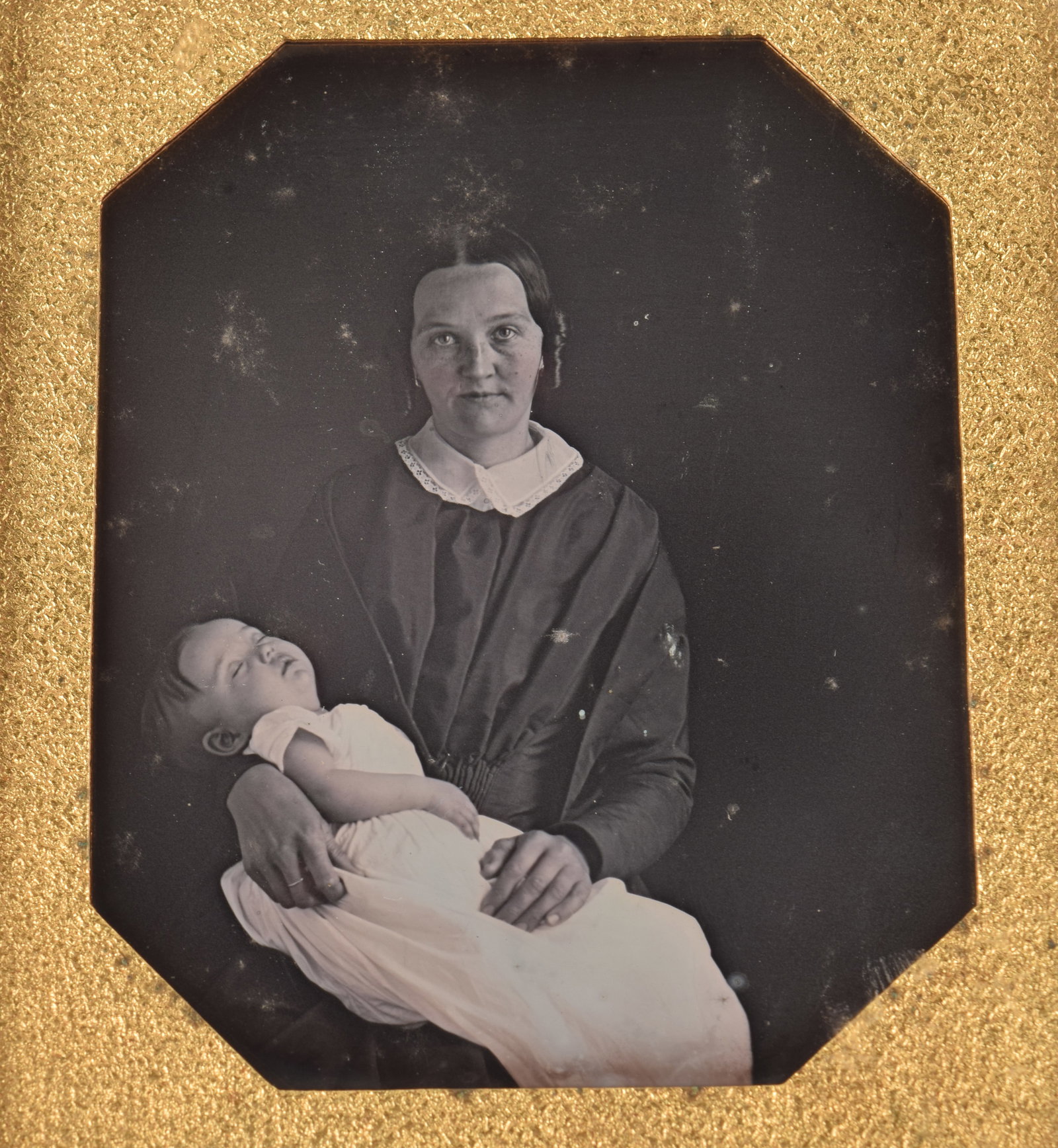 Sixth plate daguerreotype post-mortem child and mother. Leather case with repaired hinge. 3.75 x: Sixth plate daguerreotype post-mortem child and mother. Leather case with repaired hinge. 3.75 x 3.25in overall.