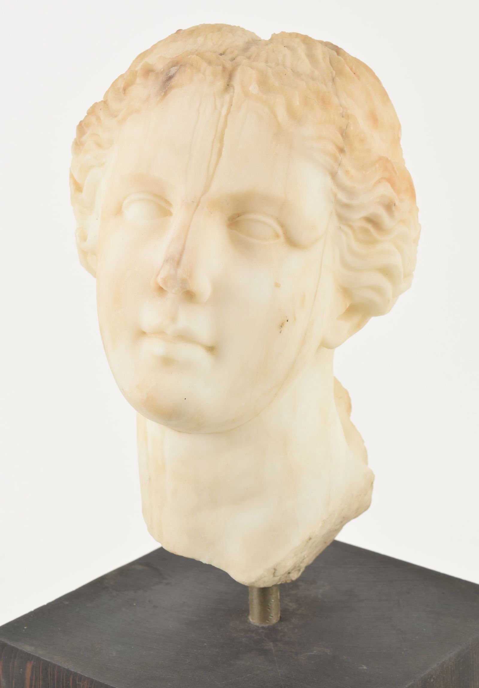 Classical Roman marble head of a woman, probably ancient. Figure angled to the side. Tight crack to (1 of 8)