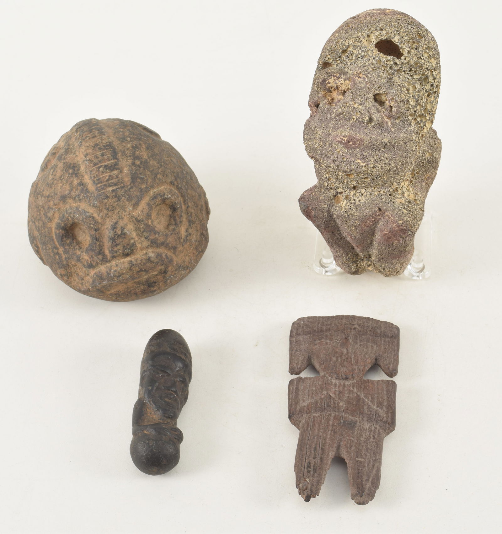 Pre-Columbian carved pieces. 1) Small black stone amulet of a figure with clasped hands. 3.25in (1 of 11)