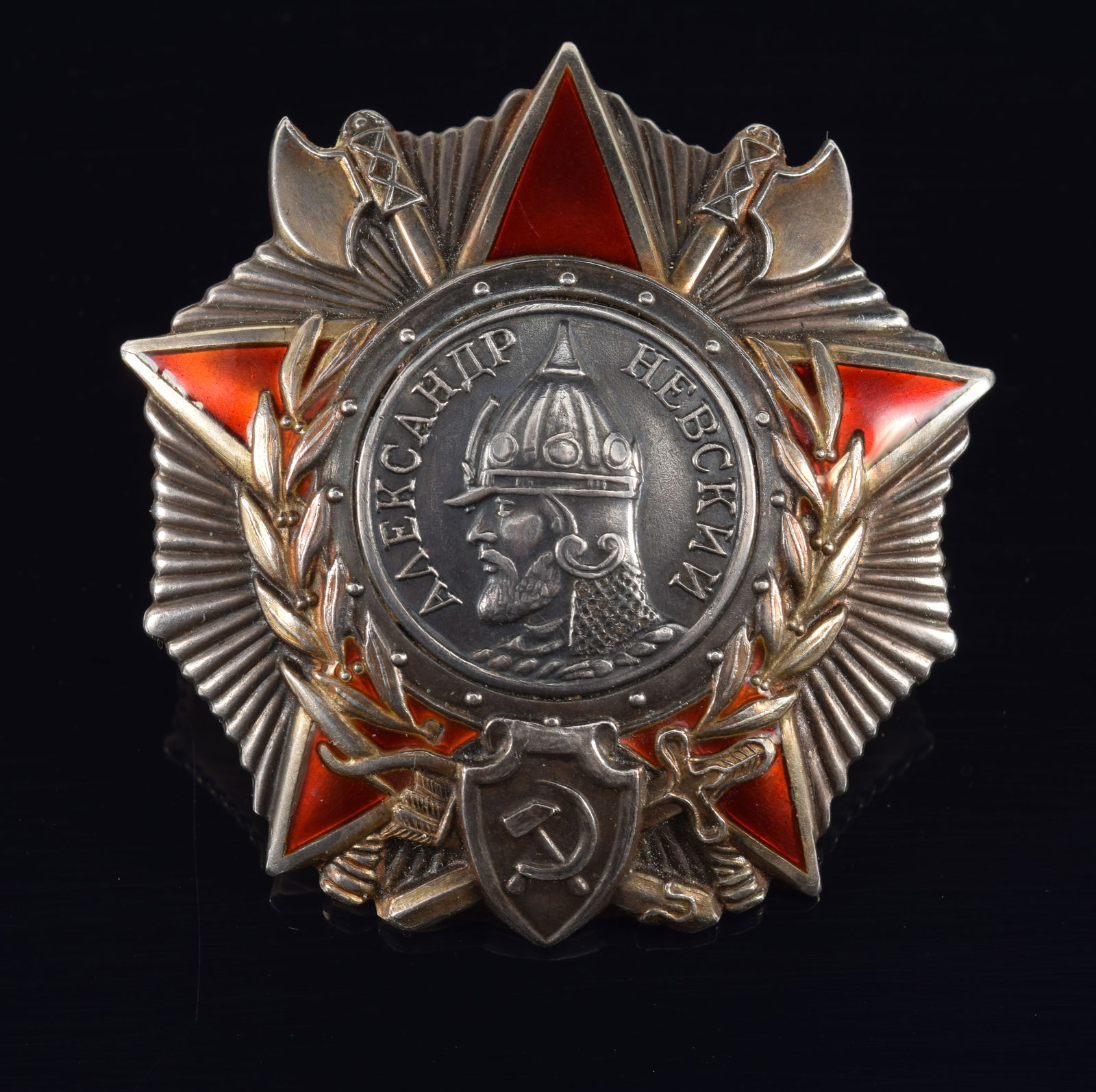 WWII Russian/Soviet Order of Alexander Nevsky, USSR, 1943. Early screwback type, Mint issue. Silver: WWII Russian/Soviet Order of Alexander Nevsky, USSR, 1943. Early screwback type, Mint issue. Silver with fired red enamel. Reverse stamped "MONETNY DVOR", serial number No. 41203. Well-preserved examp