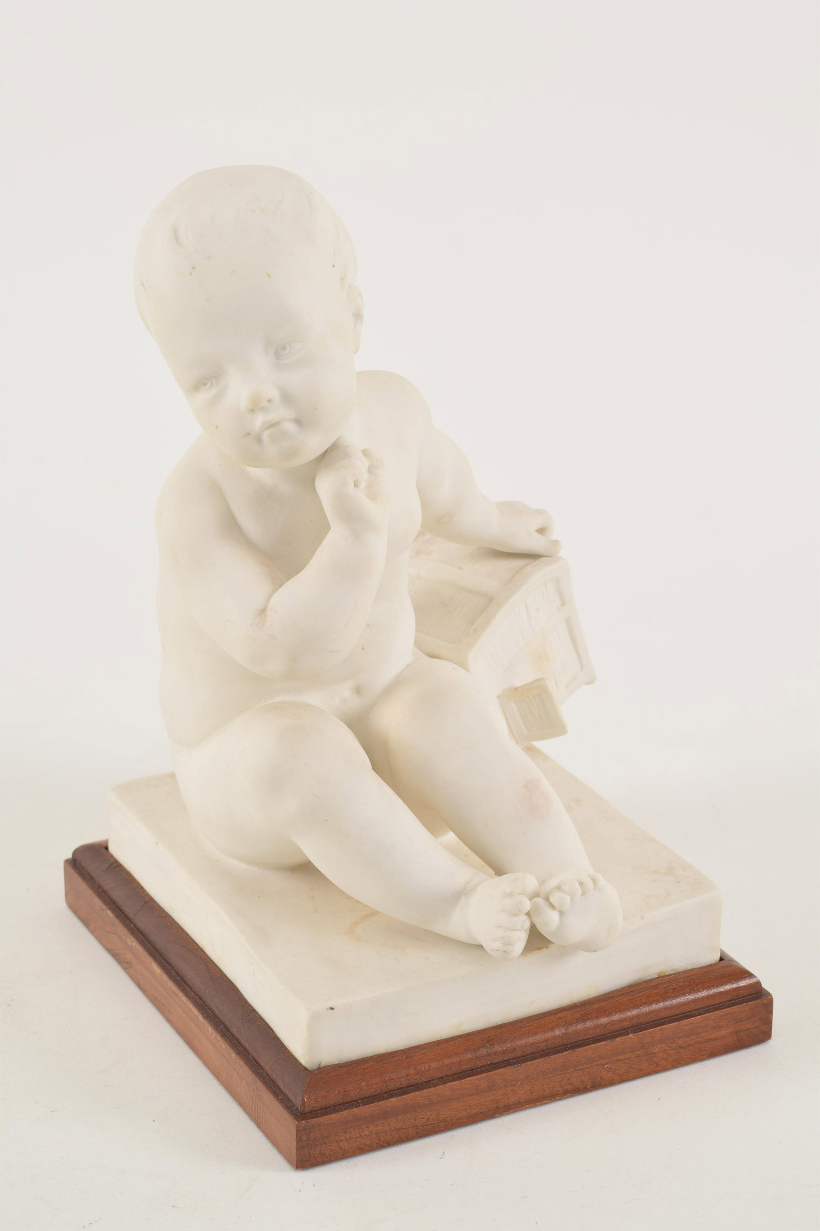 Bisque sculpture of an infant with chest, attributed to Pigalle. Stamp on reverse of base. 7.75in (1 of 5)