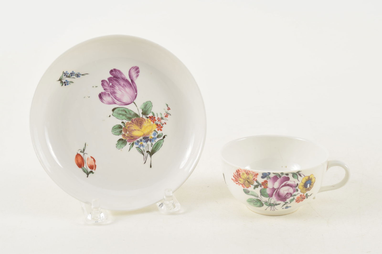 18th century porcelain cup and saucer with floral and insect decoration. Impressed marks on base. (1 of 9)