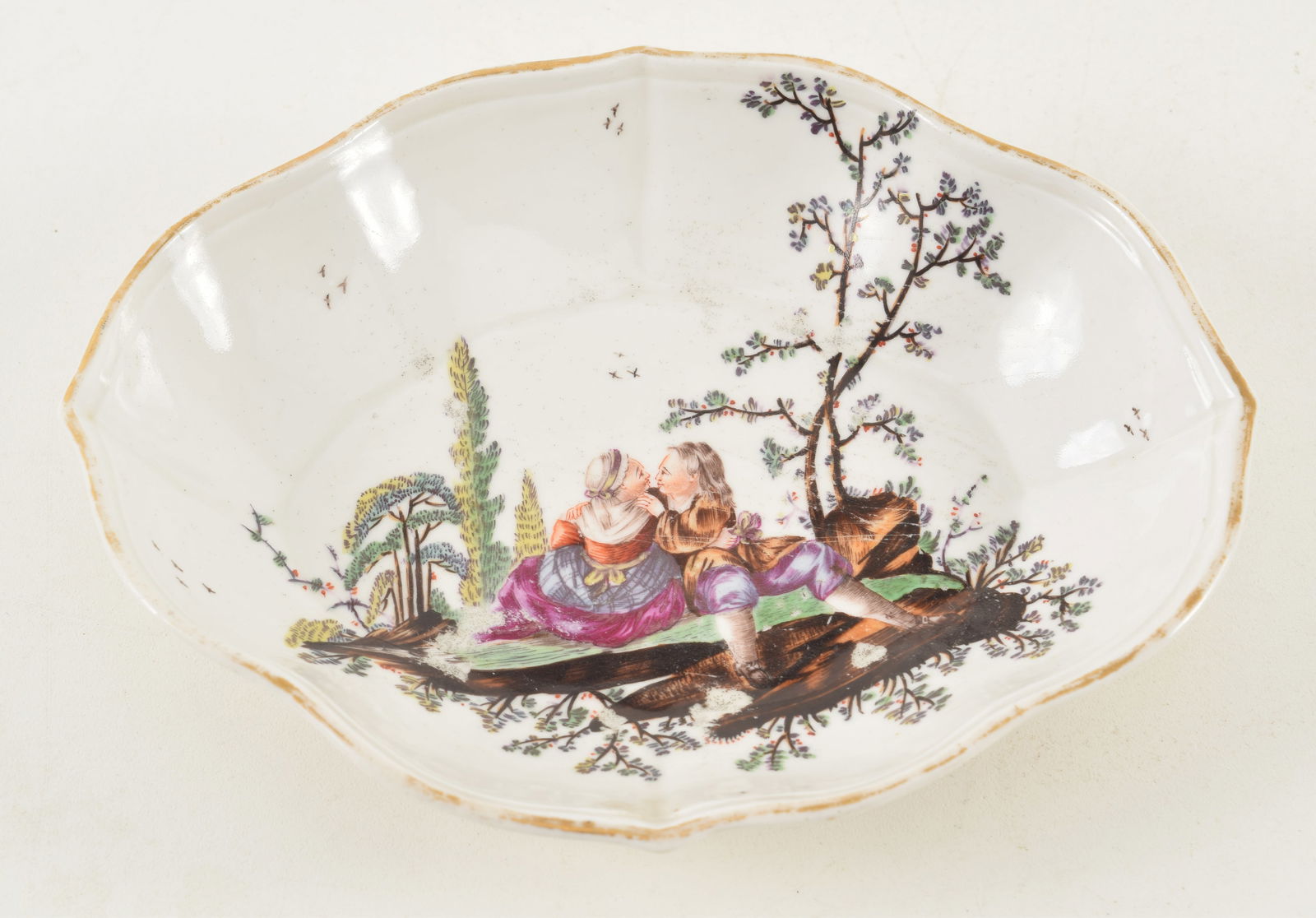 18th century porcelain shaped dish with romantic landscape decoration. Gold mark on base. 6.5in: 18th century porcelain shaped dish with romantic landscape decoration. Gold mark on base. 6.5in wide. Provenance: From a Massachusetts collection.