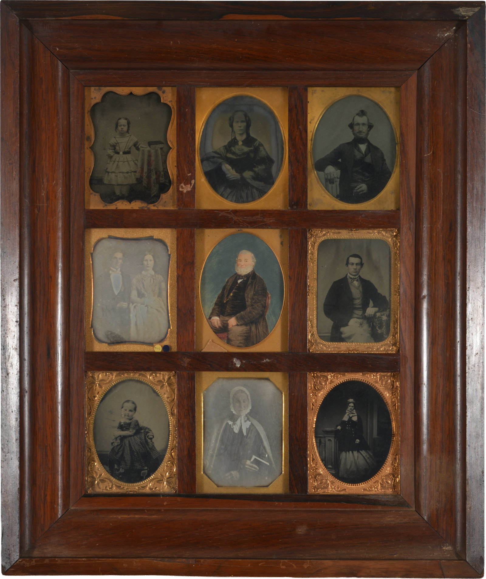 9 framed photographs, mid19th century. Nine 1/4 plate ambrotype, daguerreotype, and tintype: 9 framed photographs, mid19th century. Nine 1/4 plate ambrotype, daguerreotype, and tintype portraits in a period 3x3 frame. Some losses to frame. Each photo opening size: 4 1/8 x 3in. Overall: 18.75