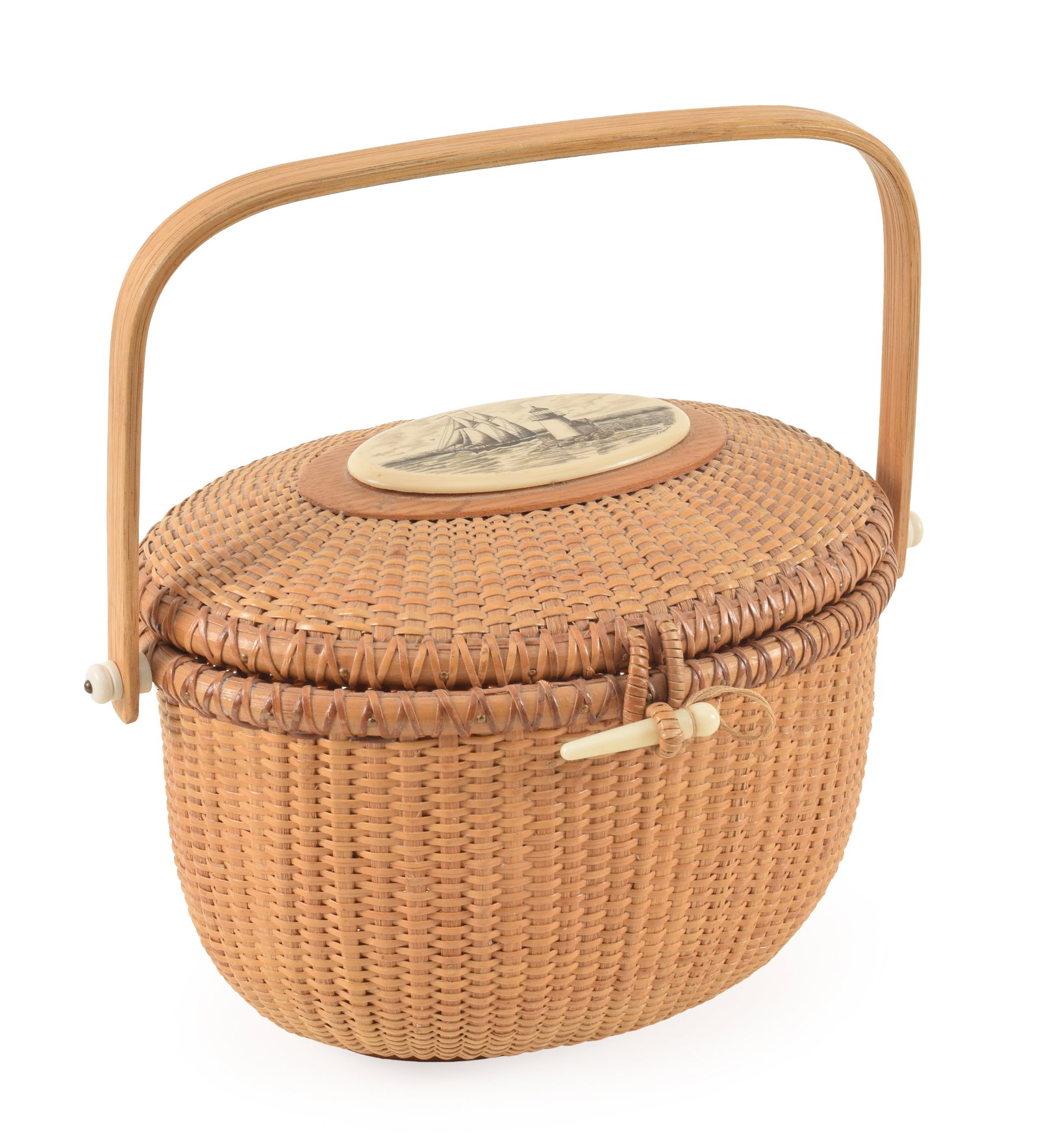 Linda Layden Nantucket basket purse. Signed scrimshaw style plaque on lid with lighthouse and: Linda Layden Nantucket basket purse. Signed scrimshaw style plaque on lid with lighthouse and sailing ship. 11in length.
