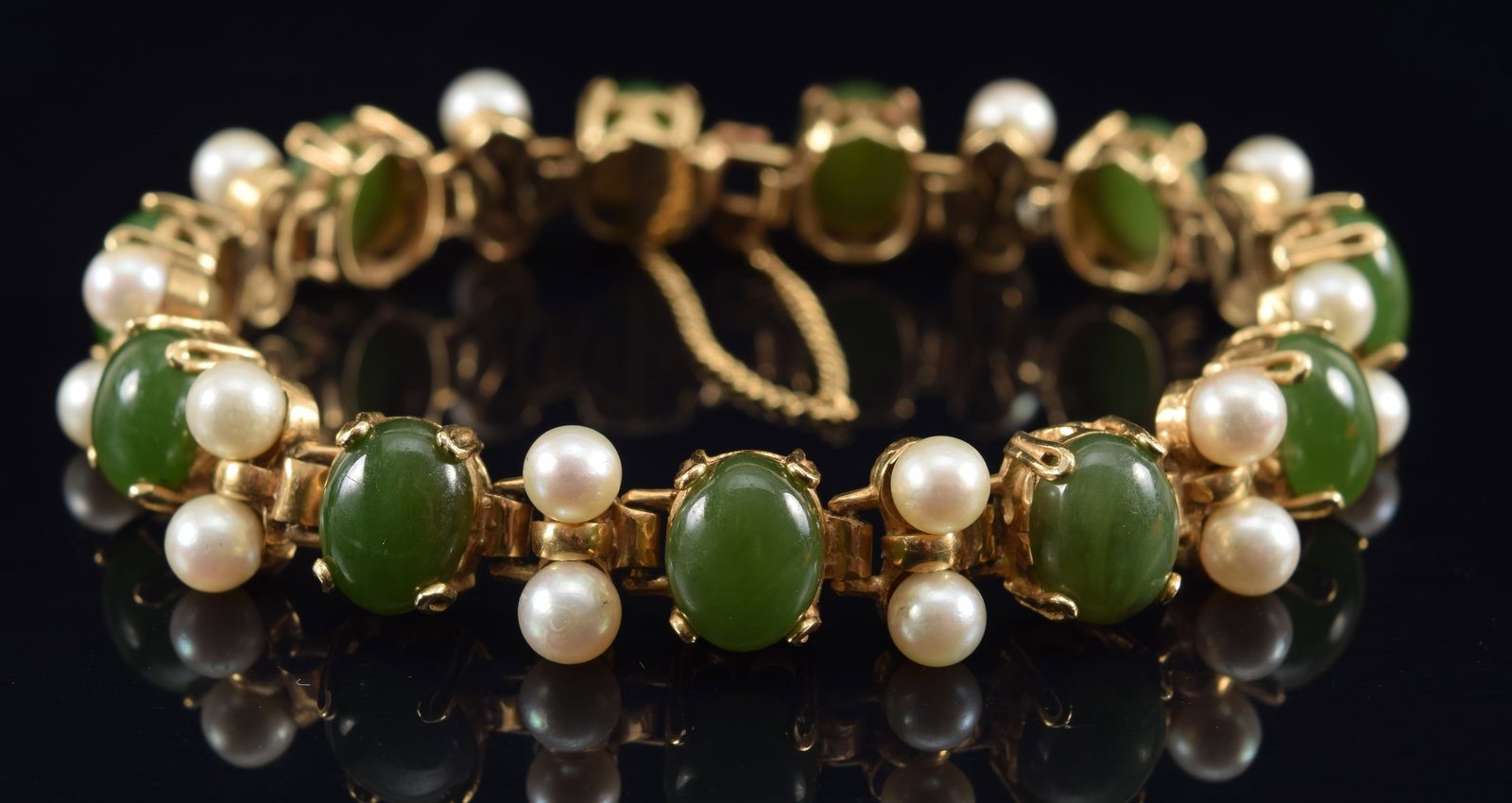 14K gold chrysoprase and pearl bracelet. Green chrysoprase oval cabochons about 10 x 8mm. Clasp: 14K gold chrysoprase and pearl bracelet. Green chrysoprase oval cabochons about 10 x 8mm. Clasp marked 14K. Diameter when clasped: 2.25in. 29.5 grams.