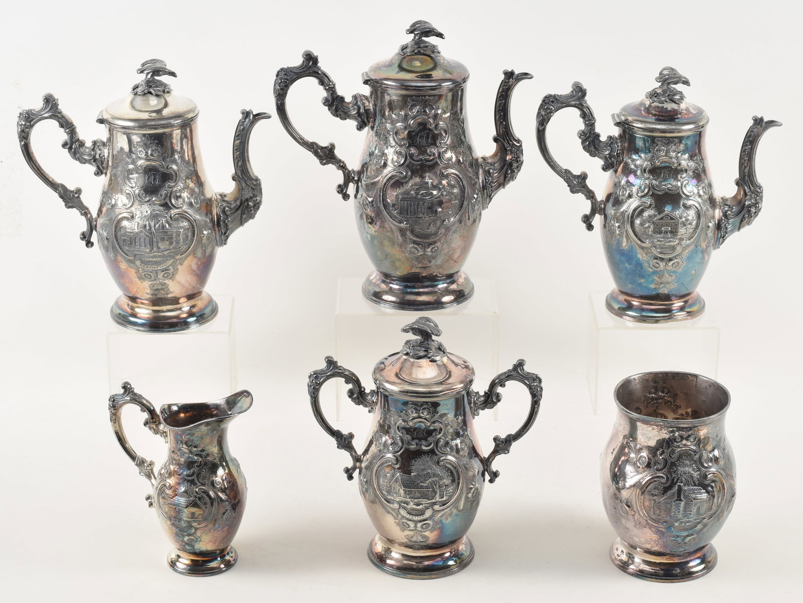 6-piece Presidential and patriotic themed silver plated tea set, mid 19th century. Each piece: 6-piece Presidential and patriotic themed silver plated tea set, mid 19th century. Each piece uniquely decorated in relief with sights of important Americans. Includes: 1) Tomb of Washington and Mount