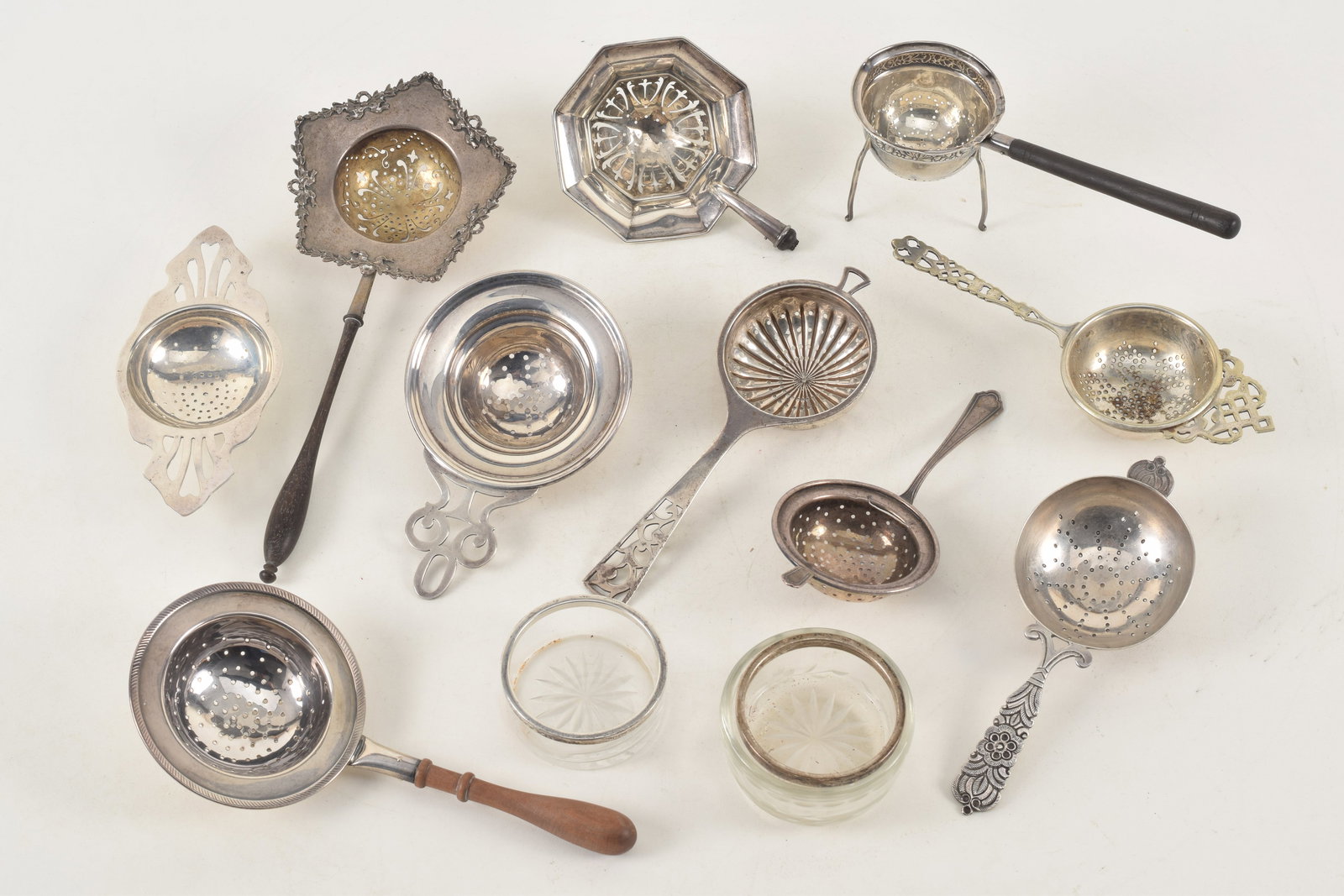 Collection 10 Silver tea strainers including 6 sterling silver. Three with wood handles and two with (1 of 8)