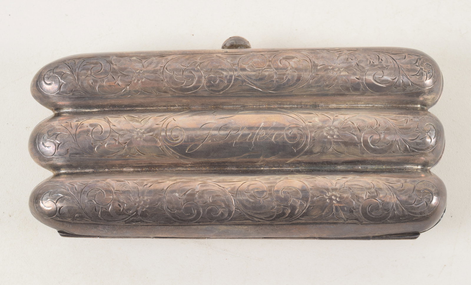 Bakersfield sterling silver presentation cigar case. Inscribed "Presented By Brewers of the: Bakersfield sterling silver presentation cigar case. Inscribed "Presented By Brewers of the Bakersfield Brewery." Reverse with engraved floral scrolling and with initials "J. Stier". Gilt washed inter