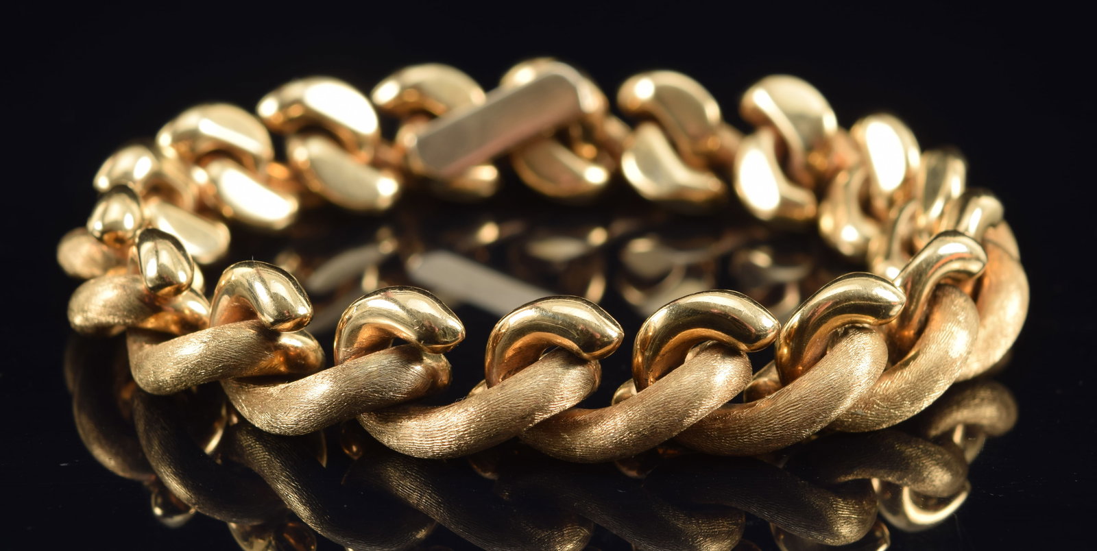 14K gold San Marco link bracelet. Alternating brushed and polished finishes. Marked inside clasp.: 14K gold San Marco link bracelet. Alternating brushed and polished finishes. Marked inside clasp. 7.75in length. 39.1 grams.