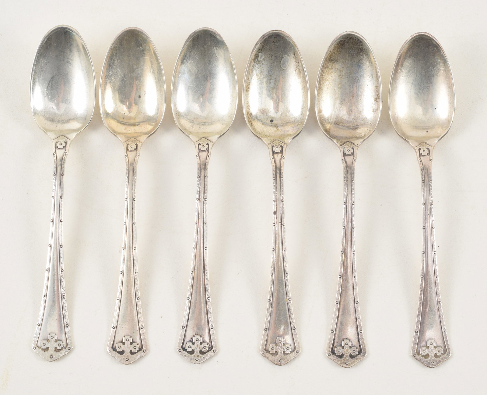 Set of 6 Wallace "Carmel" pattern sterling silver teaspoons. Arts & Crafts hand hammered design: Set of 6 Wallace "Carmel" pattern sterling silver teaspoons. Arts & Crafts hand hammered design border. Marked on reverse. 5.5in length. 3.9 ozt.