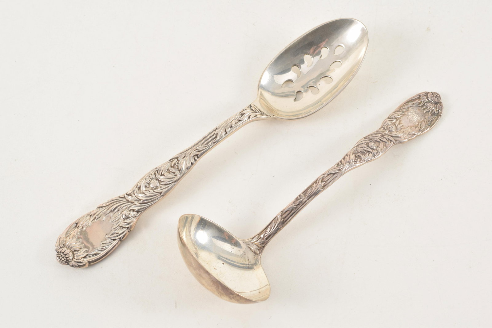 2 Tiffany & Co. "Chrysanthemum" sterling silver serving pieces. Including a ladle and a pierced: 2 Tiffany & Co. "Chrysanthemum" sterling silver serving pieces. Including a ladle and a pierced spoon. 7.08 ozt.