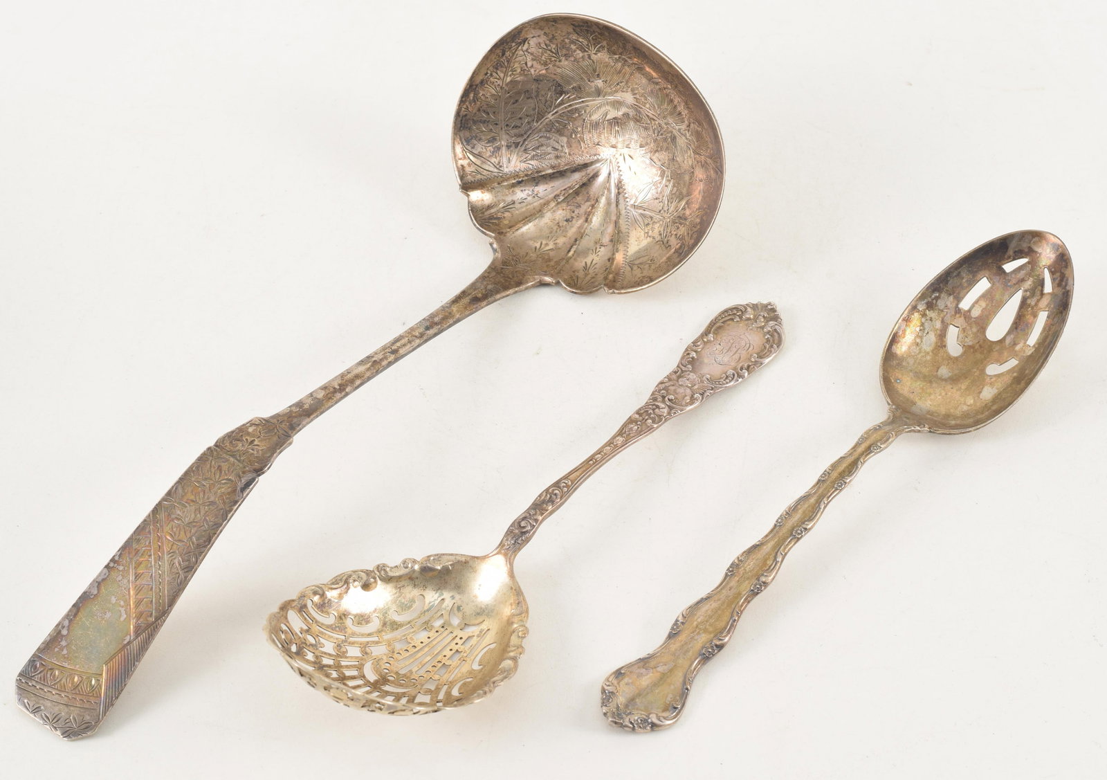 3 Victorian silver serving spoons, two pierced spoons, Dominick and Haff and Reed and Barton and an: 3 Victorian silver serving spoons, two pierced spoons, Dominick and Haff and Reed and Barton and an Eastlake pattern ladle. 9.92 ozt