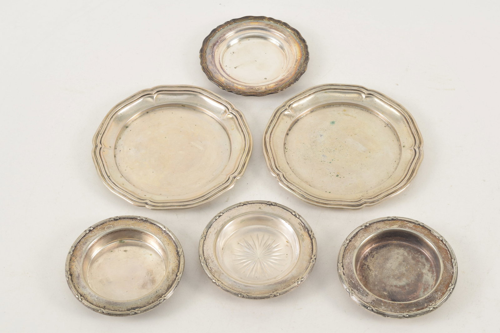 Collection of 6 small silver nut dishes and cup plates including 2 large marked 800 and others are: Collection of 6 small silver nut dishes and cup plates including 2 large marked 800 and others are plated silver. Weighable silver 3.88 ozt.