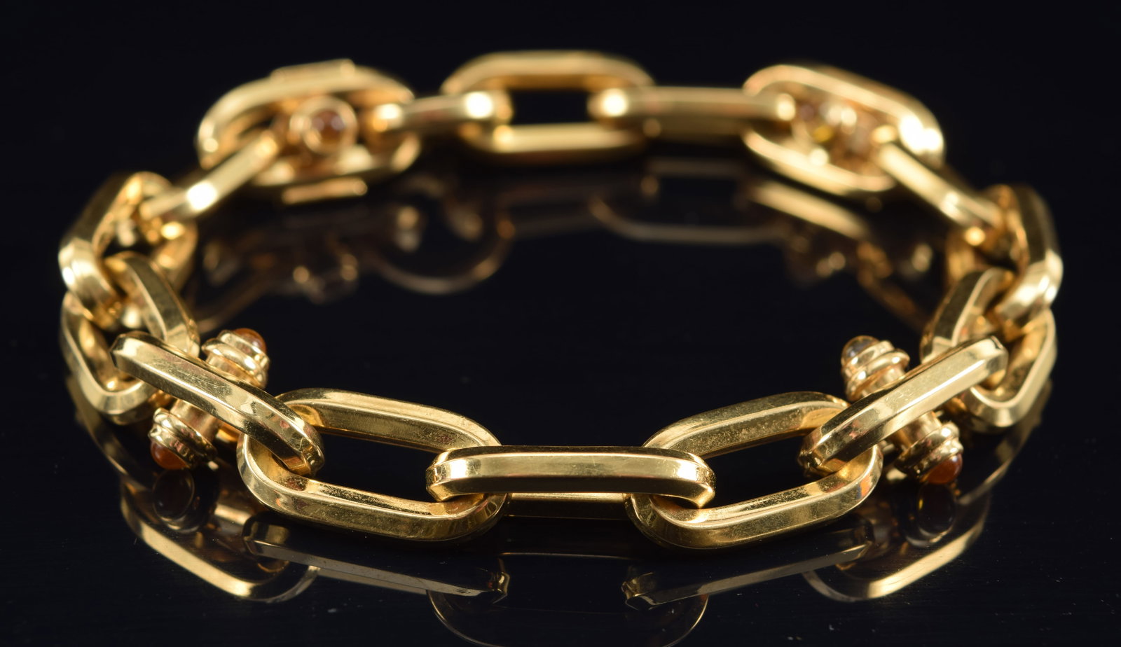 18K gold large chain link bracelet set with citrines cabochons. 8in length. Marked 18K, Italy and: 18K gold large chain link bracelet set with citrines cabochons. 8in length. Marked 18K, Italy and OTC. 20.4 grams.