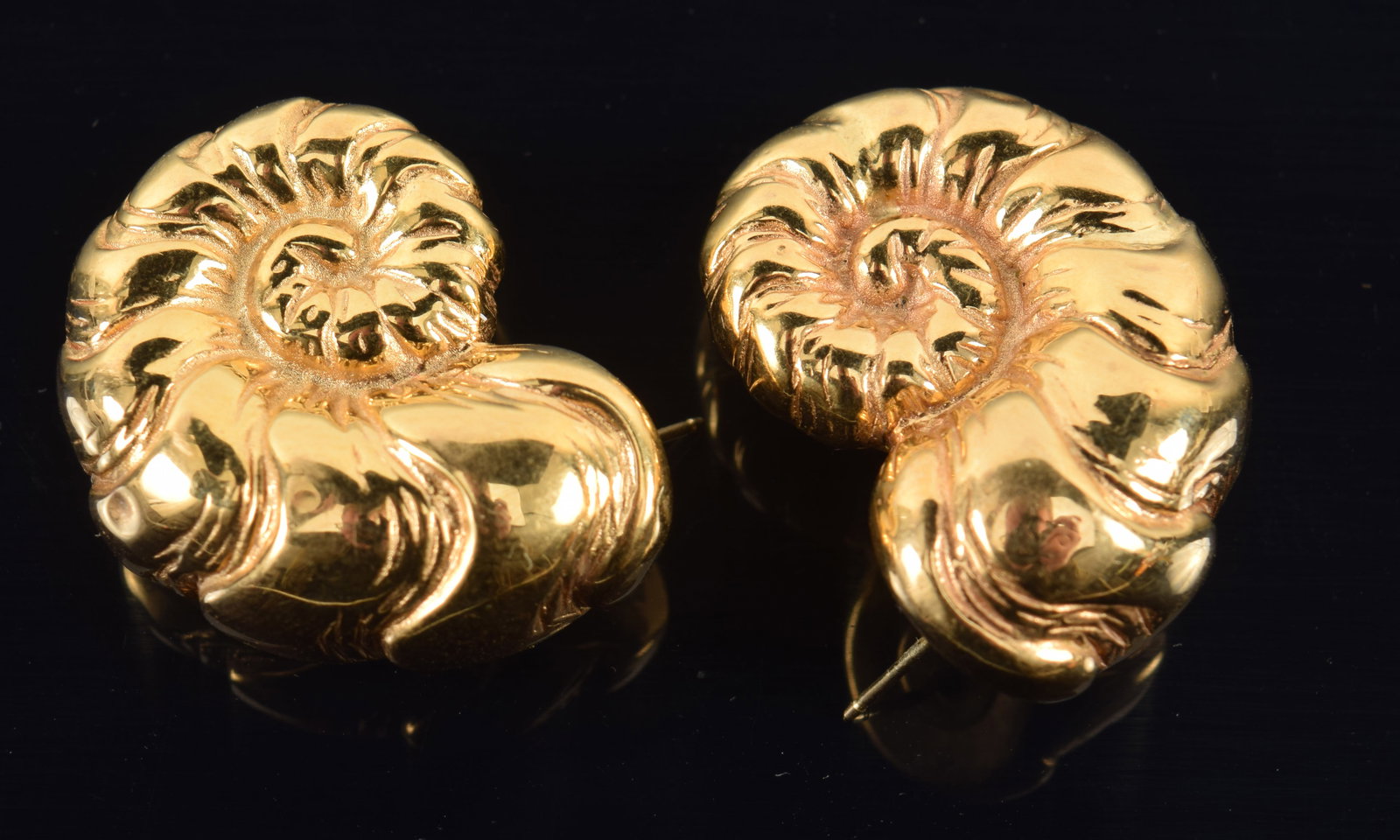 18K gold ammonite form earrings. Hollow cast. 1 1/8in length. 4.1 grams. (1 of 3)