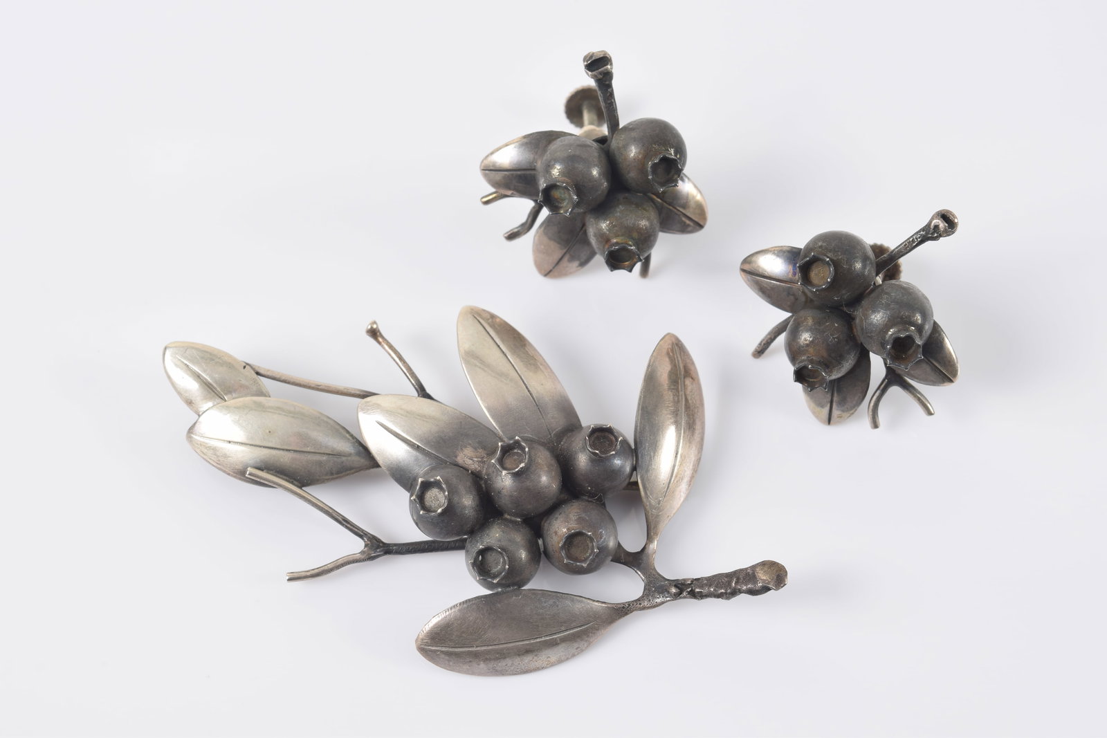Clifford Russell. Maine. Suite of blueberry cluster sterling silver jewelry. 1) Pin. 2.75in wide. 2) (1 of 4)