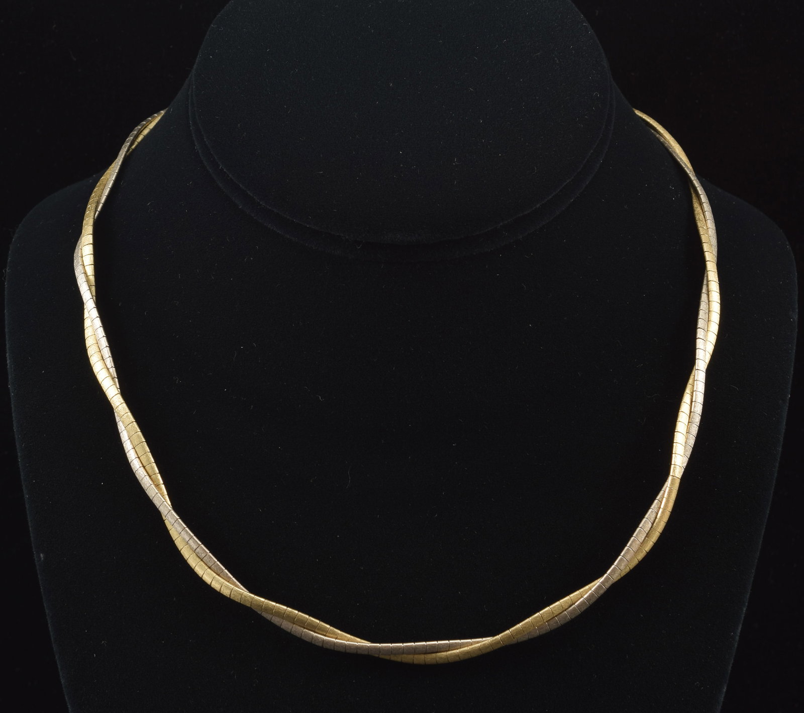 Kitsinian 14K white and yellow gold double link twist necklace. 17in length. Marked on each side of: Kitsinian 14K white and yellow gold double link twist necklace. 17in length. Marked on each side of clasp. 28.5 grams.