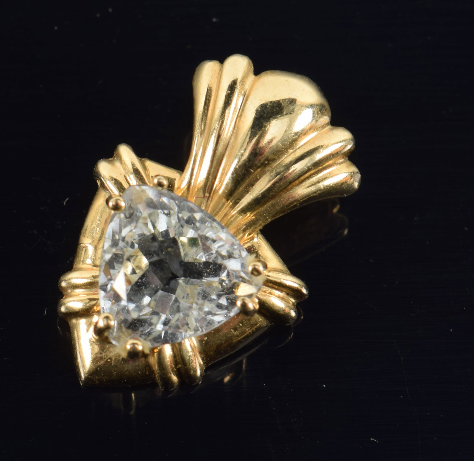 14K gold aquamarine mounted pendant. Trillion cut pale aquamarine measures approx. 8mm x 8mm.: 14K gold aquamarine mounted pendant. Trillion cut pale aquamarine measures approx. 8mm x 8mm. Unmarked but tests as 14K. 0.75in length. 2 grams.