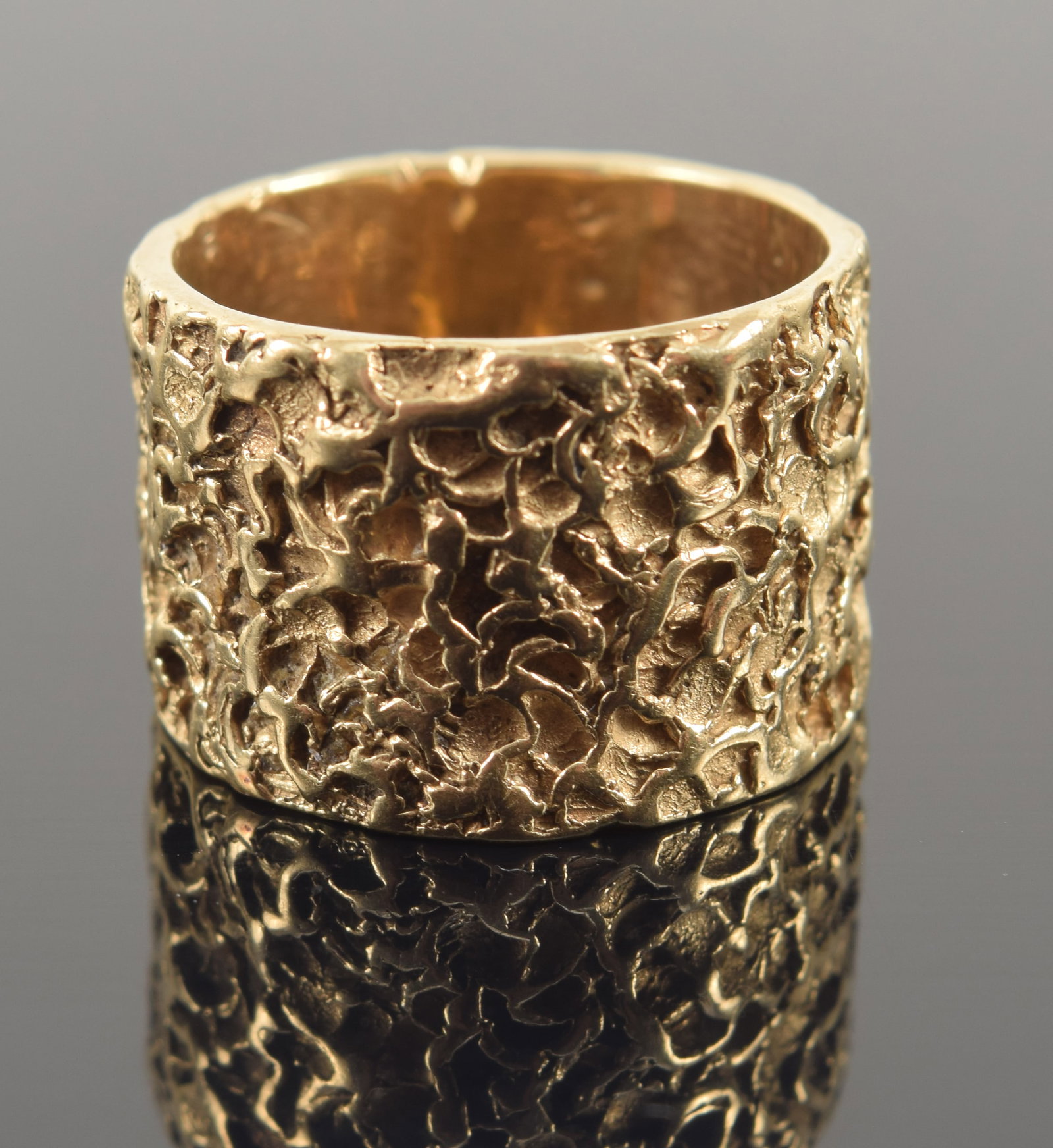 14K gold brutalist style ring. Textured surface. Unmarked but tests as 14K. Ring size 6.5. 7.3: 14K gold brutalist style ring. Textured surface. Unmarked but tests as 14K. Ring size 6.5. 7.3 grams.